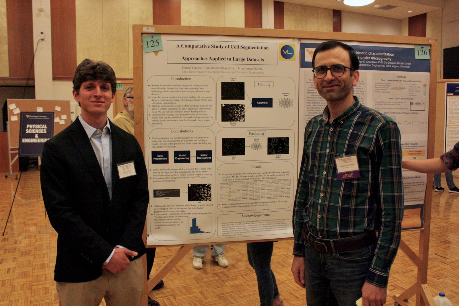 Habib Latifizadeh judging a student research poster on cell segmentation at the WVU Undergraduate Research Symposium, 2023