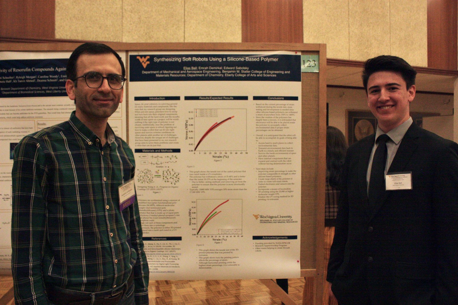 Habib Latifizadeh judging a student engineering poster on silicone-based soft robots at the WVU Undergraduate Research Symposium, 2023